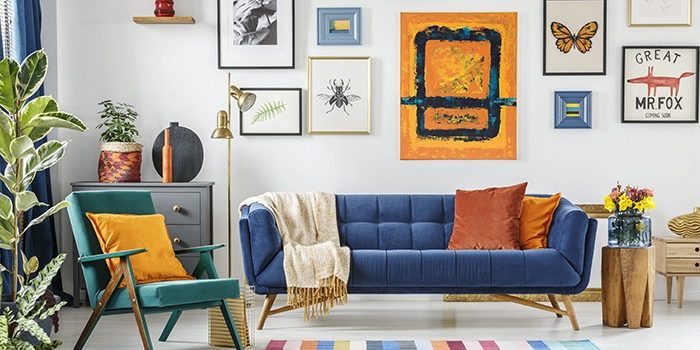 Green armchair next to blue settee in colorful living room inter Interior Decoration